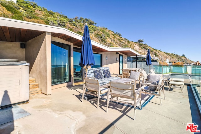 view of patio / terrace featuring a mountain view