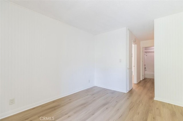 spare room with light wood-type flooring