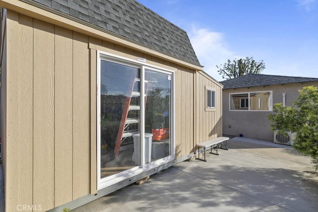 view of property exterior with a patio area