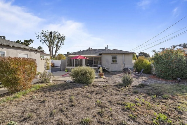 back of house with a patio area