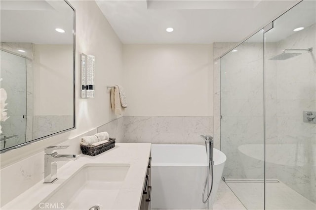 bathroom featuring vanity and plus walk in shower