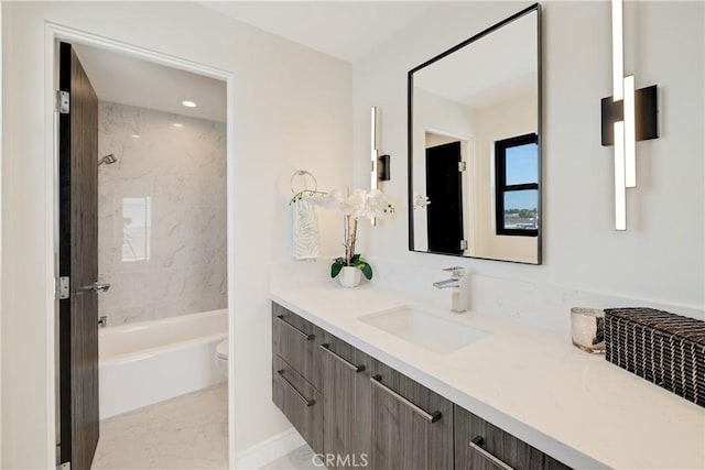 full bathroom with vanity, toilet, and tiled shower / bath