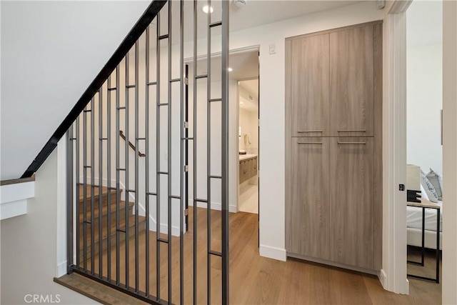 stairs featuring wood-type flooring