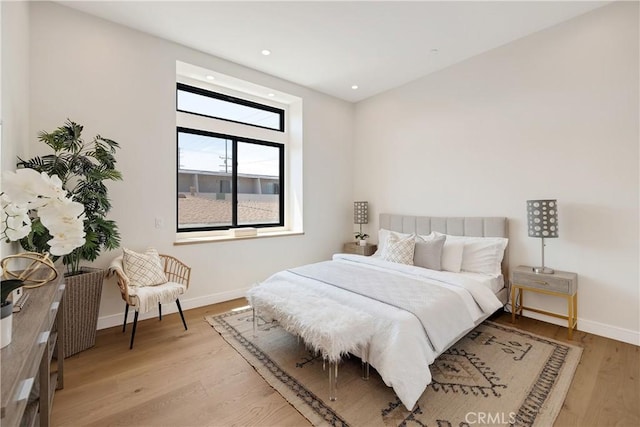 bedroom with light wood-type flooring