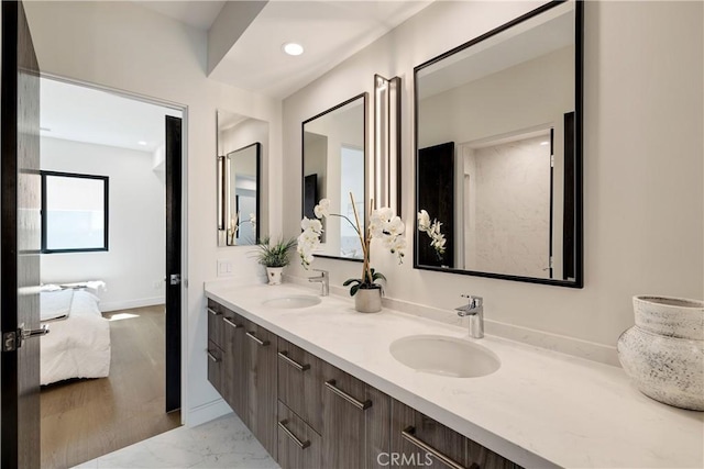 bathroom with vanity and wood-type flooring