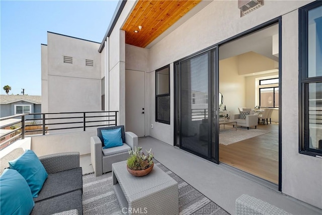 balcony with an outdoor hangout area