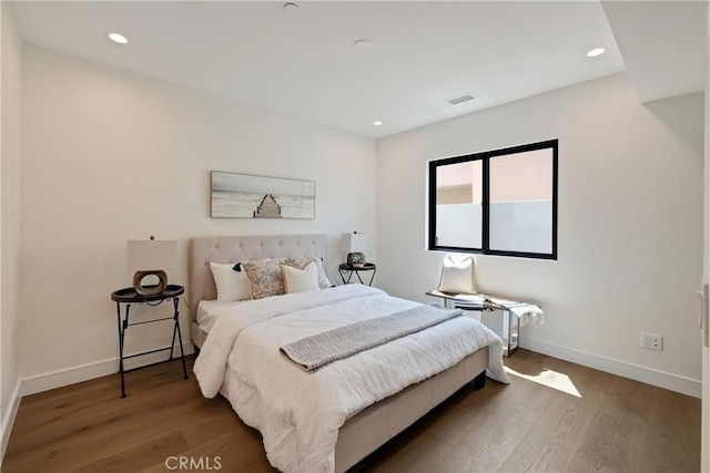 bedroom featuring wood-type flooring