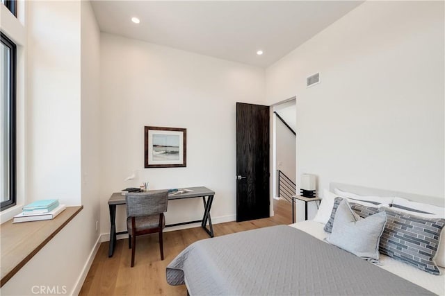 bedroom with light hardwood / wood-style flooring