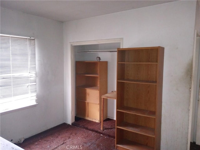 unfurnished bedroom with a closet