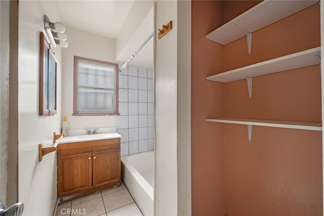 bathroom featuring tile patterned flooring and vanity