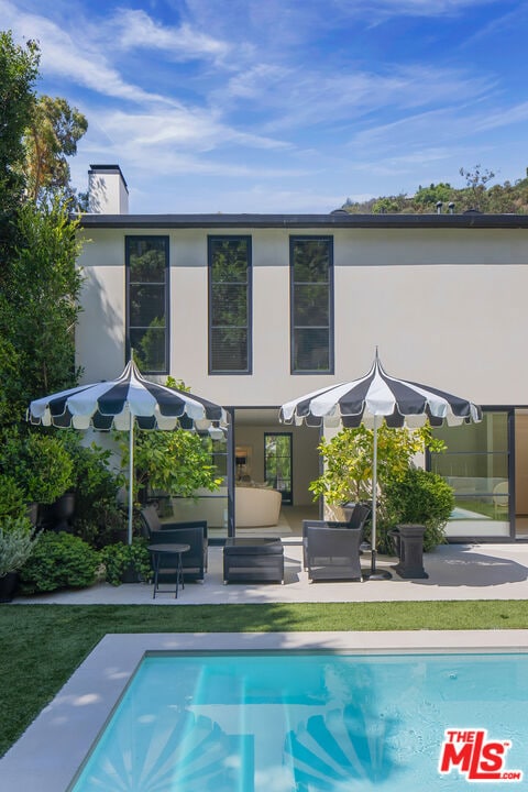 back of house featuring a patio area