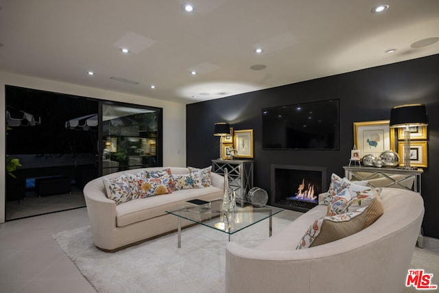 living room with light tile patterned flooring