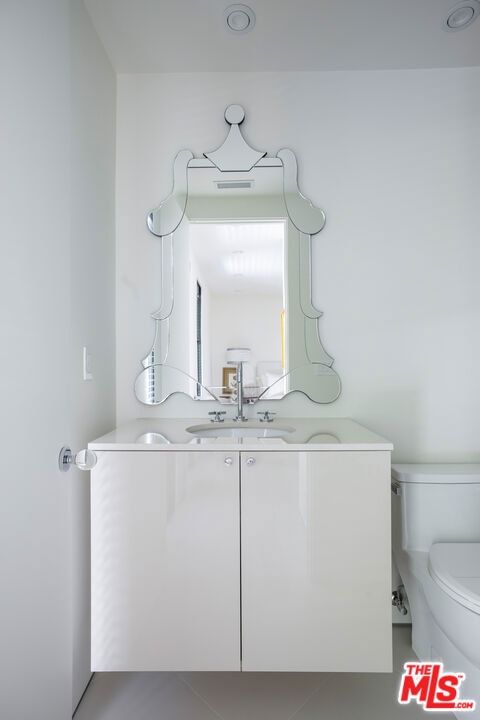 bathroom with vanity and toilet