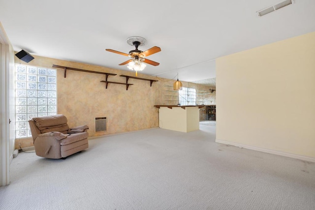 unfurnished room with light carpet and ceiling fan