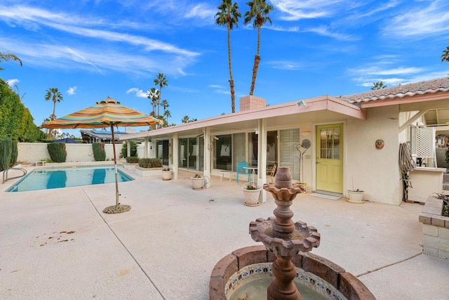 view of pool featuring a patio