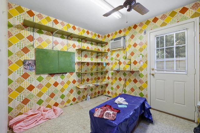 bedroom with ceiling fan and a wall mounted air conditioner