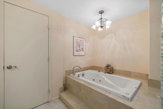 bathroom with a notable chandelier and a relaxing tiled tub