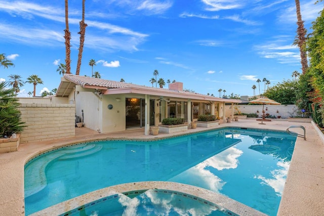 view of swimming pool featuring a patio