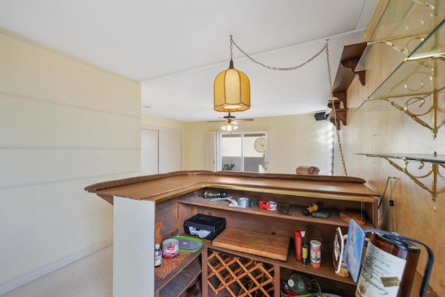 bar featuring ceiling fan and carpet floors