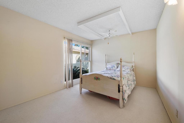 bedroom with carpet floors and a textured ceiling