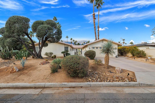 single story home featuring a garage