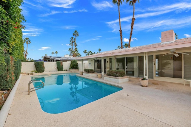 view of pool with ceiling fan and a patio