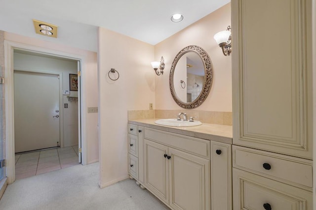 bathroom with tile patterned flooring and vanity