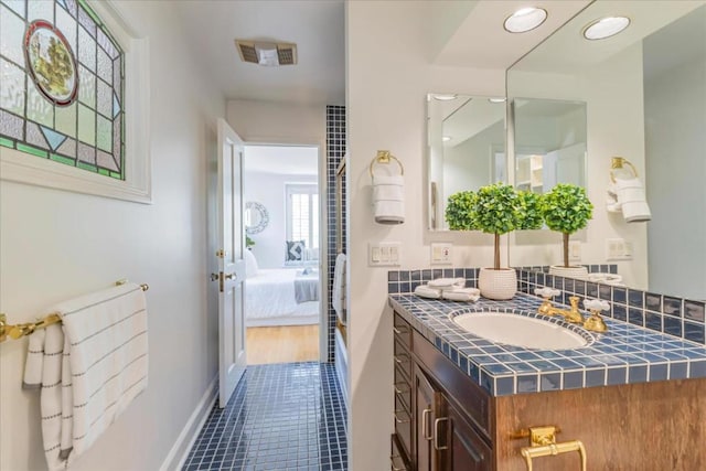 bathroom featuring vanity and tile patterned flooring