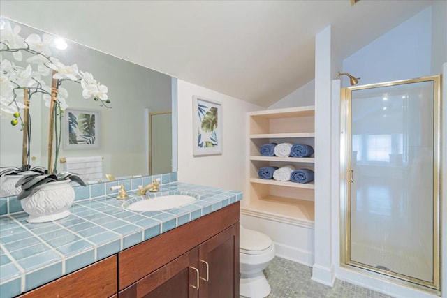 bathroom with built in shelves, vanity, toilet, and an enclosed shower