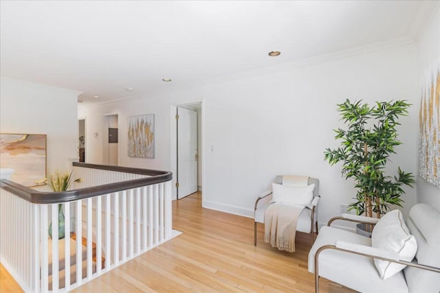 interior space with ornamental molding and light hardwood / wood-style flooring