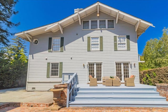 rear view of property featuring french doors and a patio