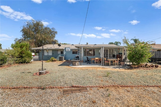 back of property featuring central air condition unit and a patio area