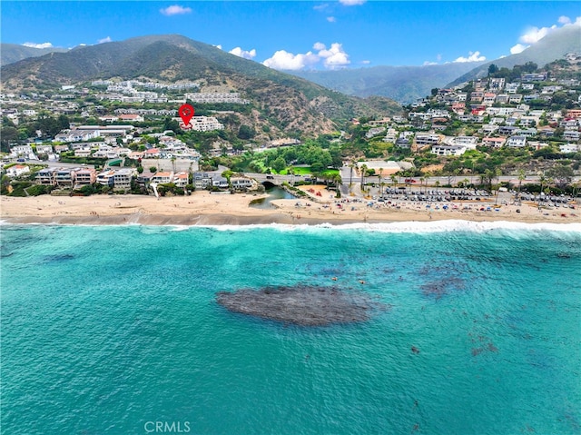 aerial view with a beach view and a water and mountain view