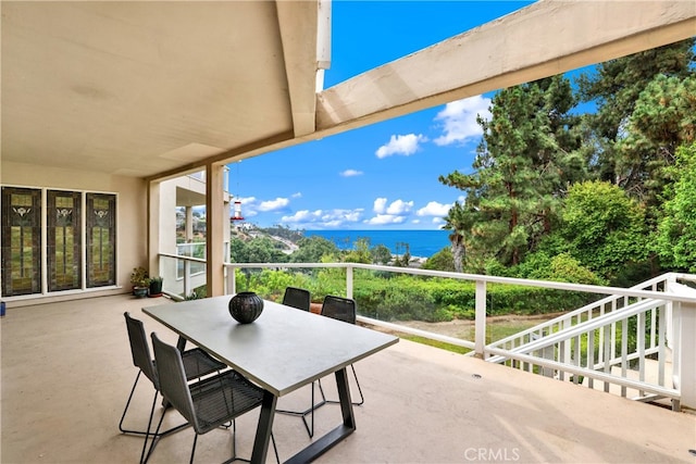 view of patio featuring a water view