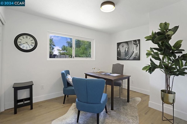 office area with light hardwood / wood-style floors