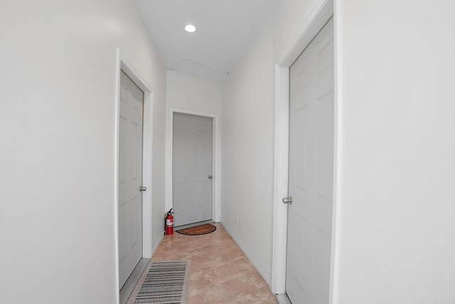 corridor featuring light tile patterned flooring