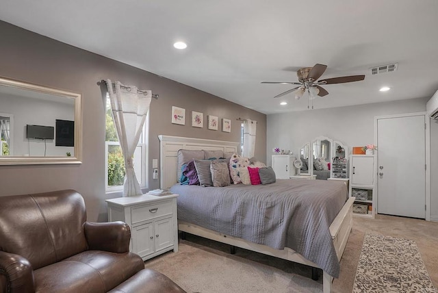 carpeted bedroom with ceiling fan