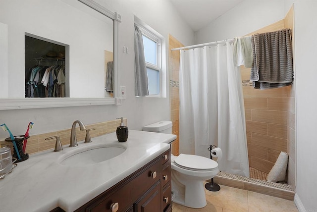 bathroom with vanity, tile patterned flooring, a shower with shower curtain, and toilet