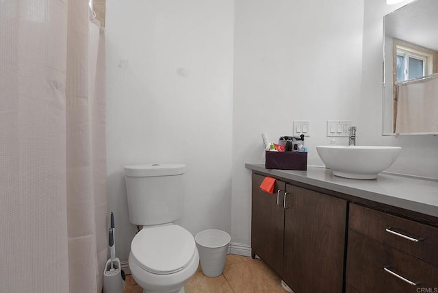 bathroom featuring tile patterned floors, vanity, and toilet