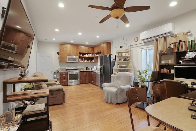 living room with a wall mounted air conditioner, sink, light wood-type flooring, and ceiling fan