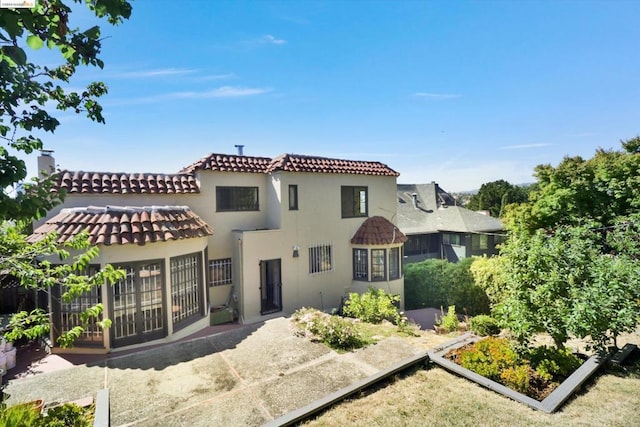 rear view of house featuring a patio