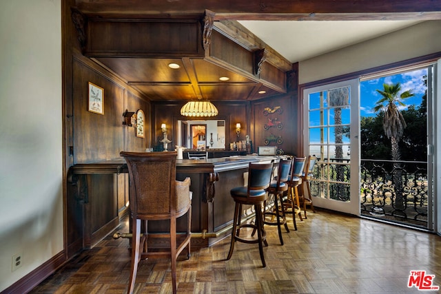 bar featuring wooden walls, coffered ceiling, beam ceiling, and dark parquet flooring