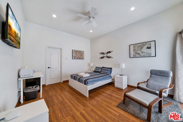 bedroom featuring hardwood / wood-style floors and ceiling fan