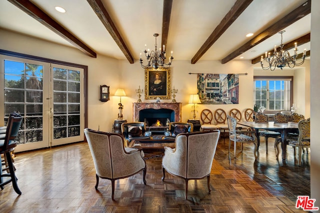 living room featuring parquet flooring, a notable chandelier, beamed ceiling, and a fireplace