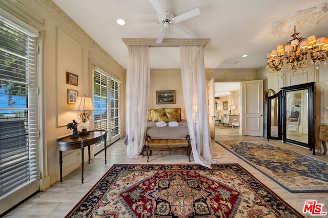 foyer with light hardwood / wood-style flooring and ceiling fan with notable chandelier