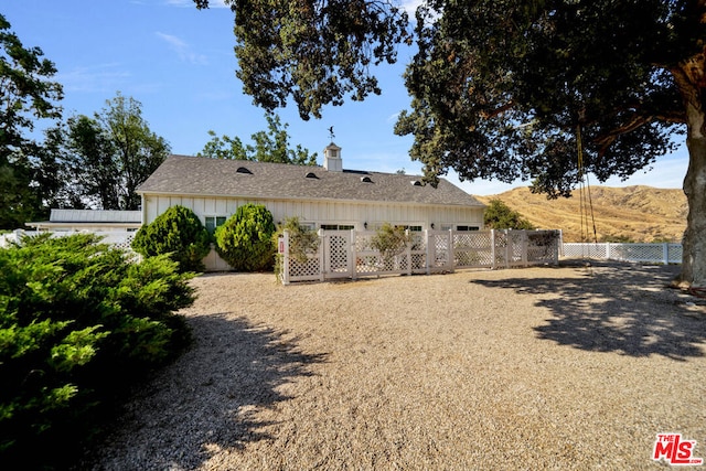 rear view of house with a mountain view