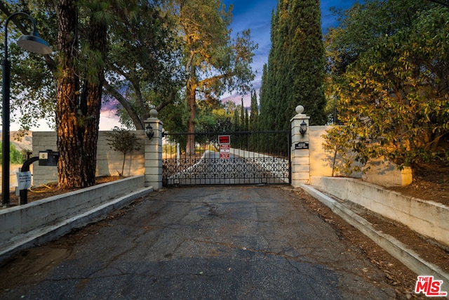 view of gate at dusk