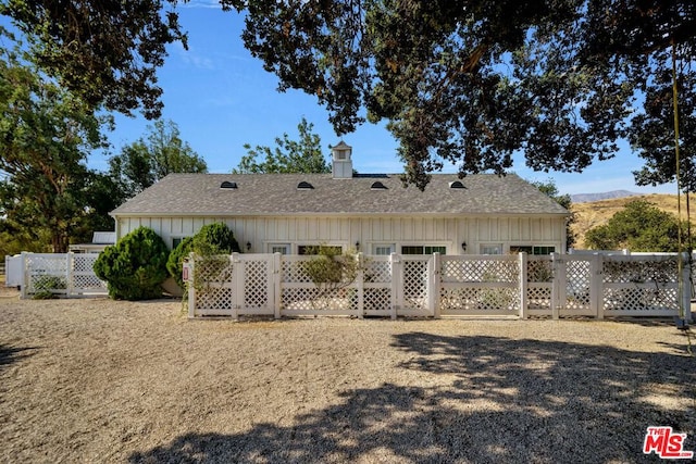 back of property featuring a mountain view