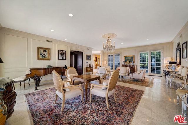 dining space with a notable chandelier, light tile patterned floors, and crown molding