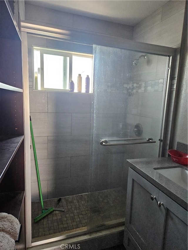 bathroom with vanity and walk in shower